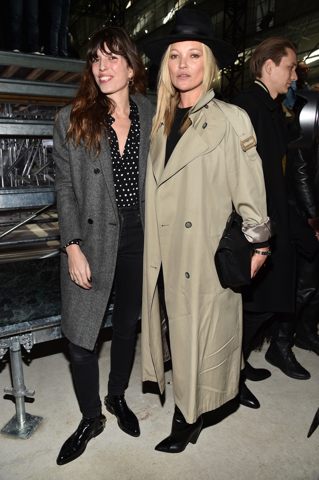Lou Doillon, Jane Birkin's daughter, and fashion icon Kate Moss get their best coats out at the Saint Laurent Fashion Show.