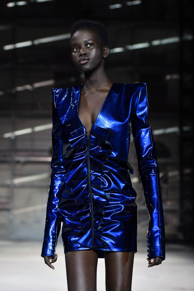 We love everything in this Saint Laurent mini dress: the metallic blue colour, retro shoulder pads and extra long sleeves. Futuristic and cool!
