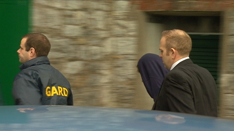 Ross Outram (hooded) arriving at court this morning