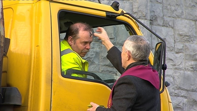Fr Paddy Mooney blesses a motorist