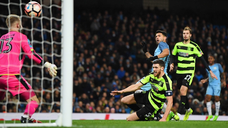 Sergi Aguero scores his second and Manchester City's fourth goal of the night at the Etihad Stadium