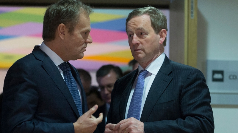 Donald Tusk (L) and Enda Kenny chat ahead of their meeting in Brussels