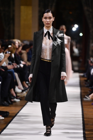 Model Bella Hadid super classy in lace and feathers at the Lanvin Fashion Show.