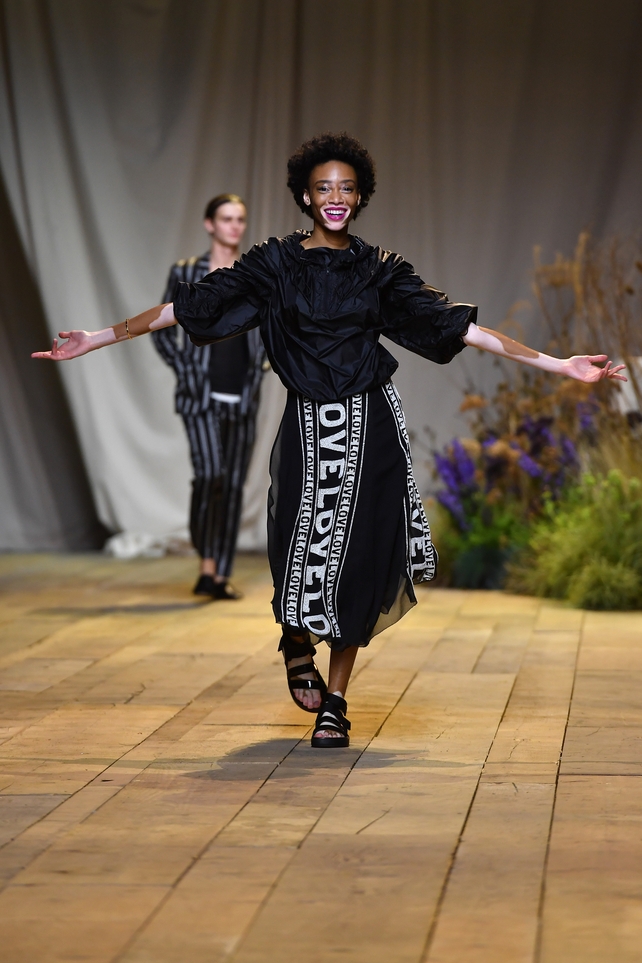 A radiant and happy Winnie Harlow is spreading some love at the H&M Studio Fashion Show.