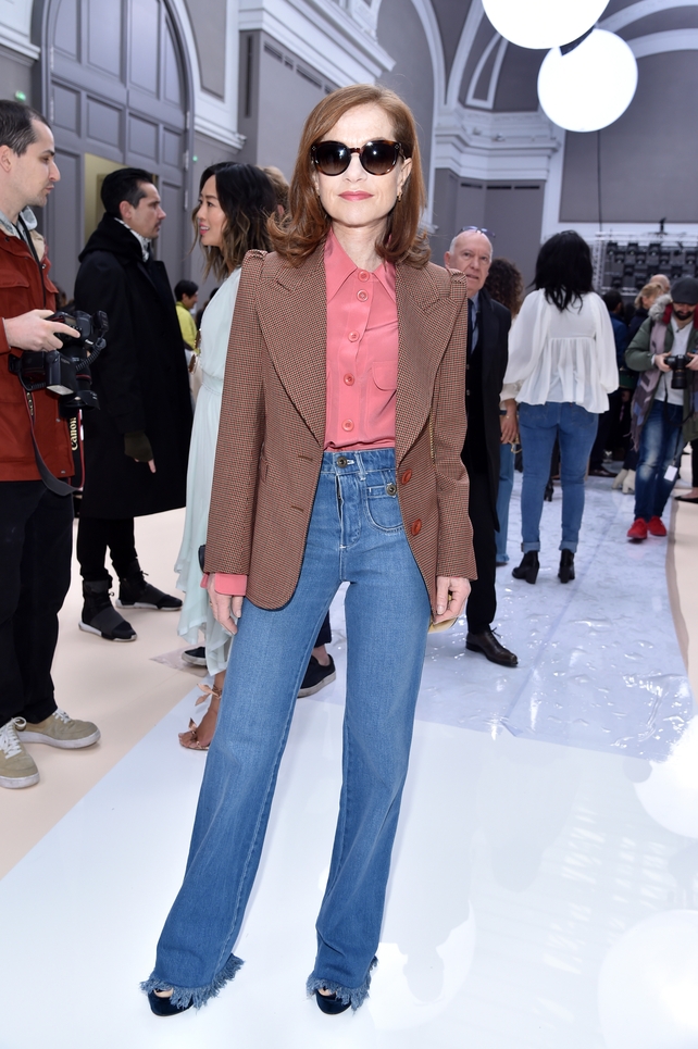 Isabelle Huppert back from the Oscars in a spring outfit at the Chloé Fashion Show.
