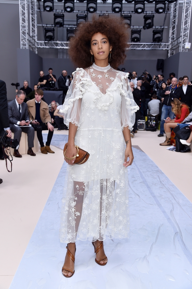 Solange Knowles looks romantic in a sheer white dress at the Chloé Fashion Show.