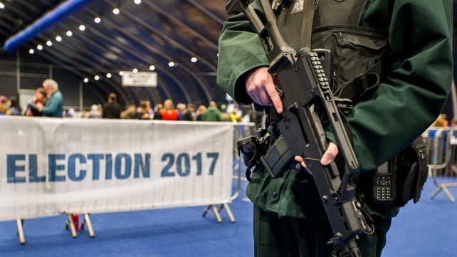 A PSNI officer patrols at the main Belfast count centre