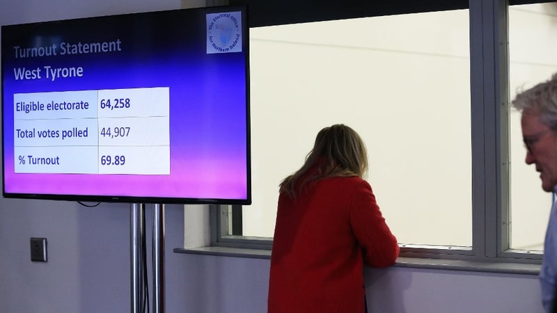 A screen at the Omagh count centre displays turnout numbers for West Tyrone as counting is under way