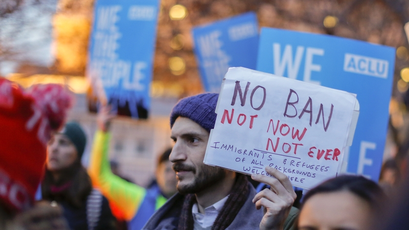 A protest outside the White House yesterday after Donald Trump signed the revised order