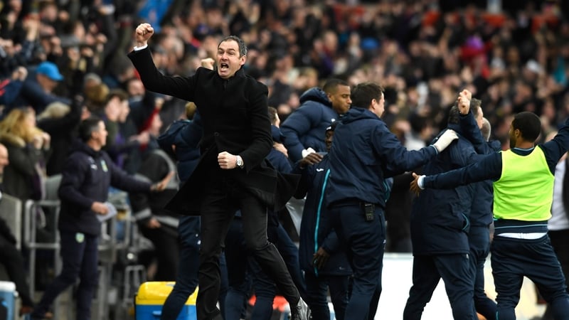 Paul Clement shows his delight after Swansea scored late to beat Burnley
