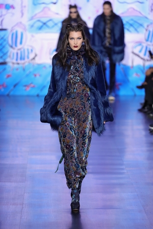Bella at the Anna Sui New York Fashion Week Show this year wearing a maxi velvet floral dress and double bun hairstyle.