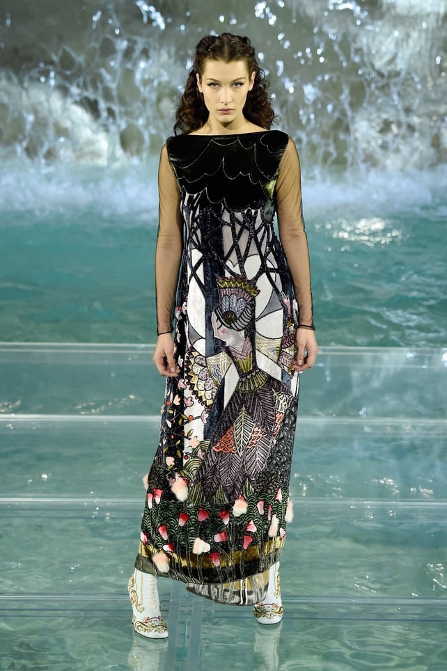 Bella in a fairytale and graphic dress at the Fendi '90 Years Anniversary Fashion Show' in 2016. This Scarlett O'Hara hairstyle suits her perfectly!