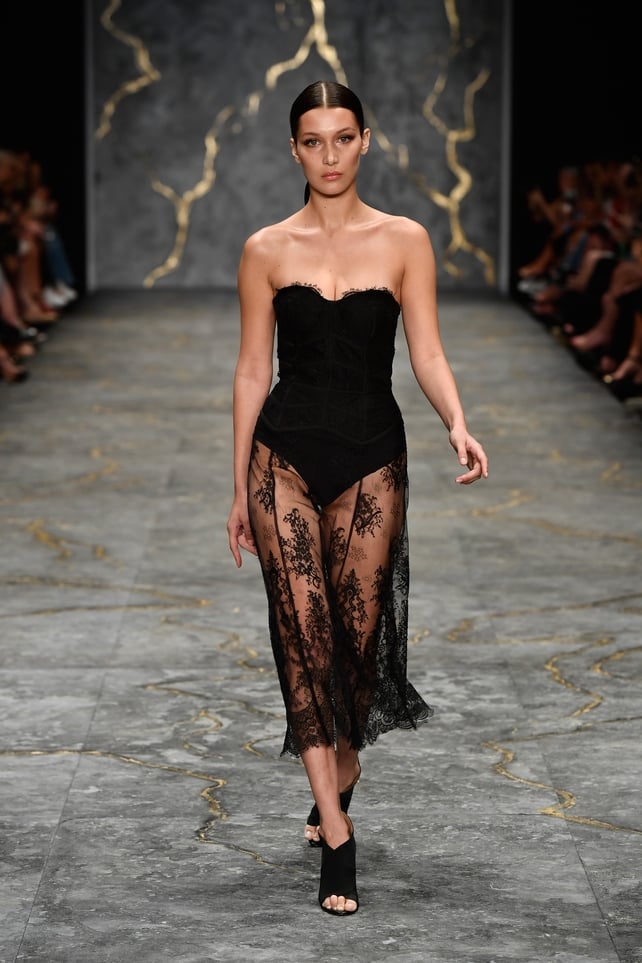 The model in a gorgeous lace and bustier dress at the Misha Collection Show during the Mercedes-Benz Fashion Week in 2016.