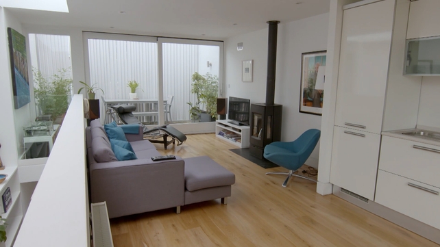 Alec's home has beautiful floor to ceiling picture windows.