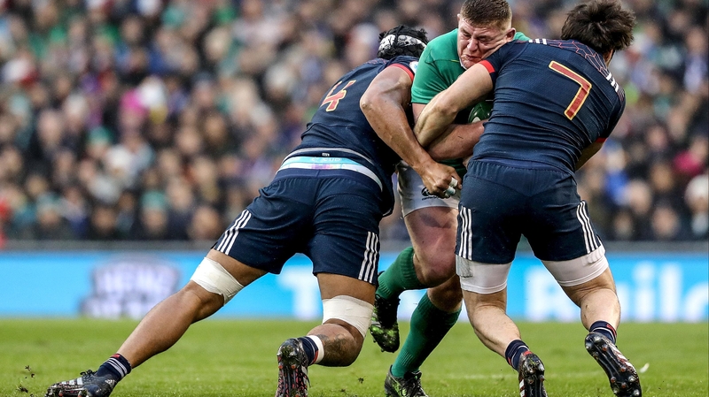 Tadhg Furlong is tackled by Kévin Gourdon and Sébastien Vahaamahina of France