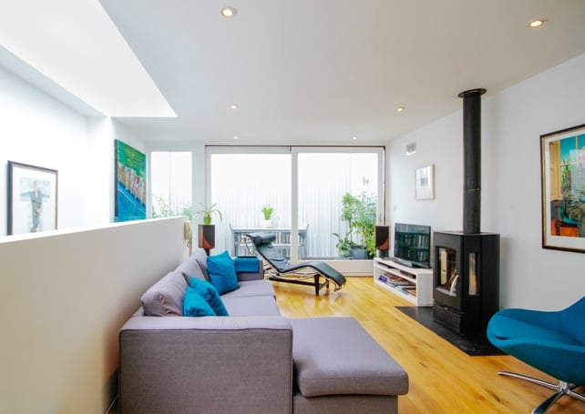 Floor to ceiling picture windows flood the home with light