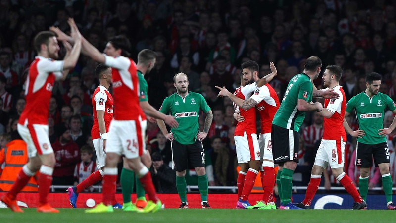 Arsenal players celebrate Theo Walcott's opener at the Emirates