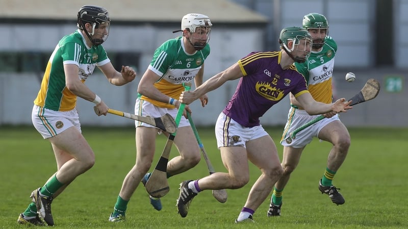 Offaly's Aidan Treacy, Dermot Shortt and Derek Morkan tackle Harry Kehoe of Wexford