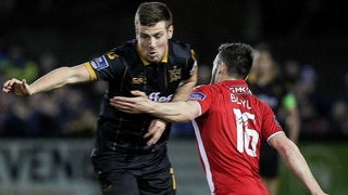 Dundalk's Patrick McEleney (L) tussles with Derry City's Nathan Boyle