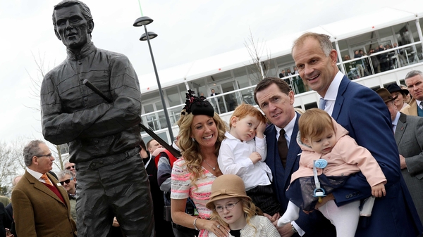 AP McCoy alongside his wife Chanelle and children beside his new statue