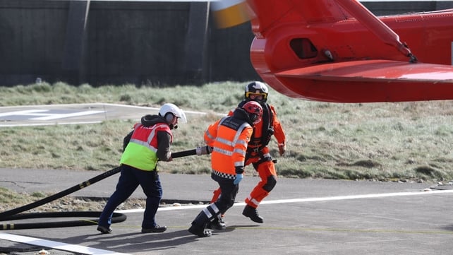 An Irish Coast Guard helicopter returns to Blacksod for refuelling, as the search continues