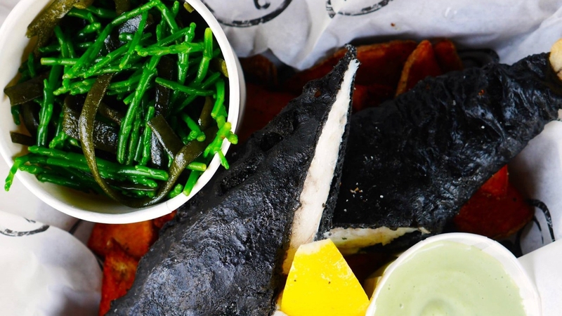 Guinness and Ink Tempura of Hake with Oyster and Sorrel sauce and seaweed salted chips.
