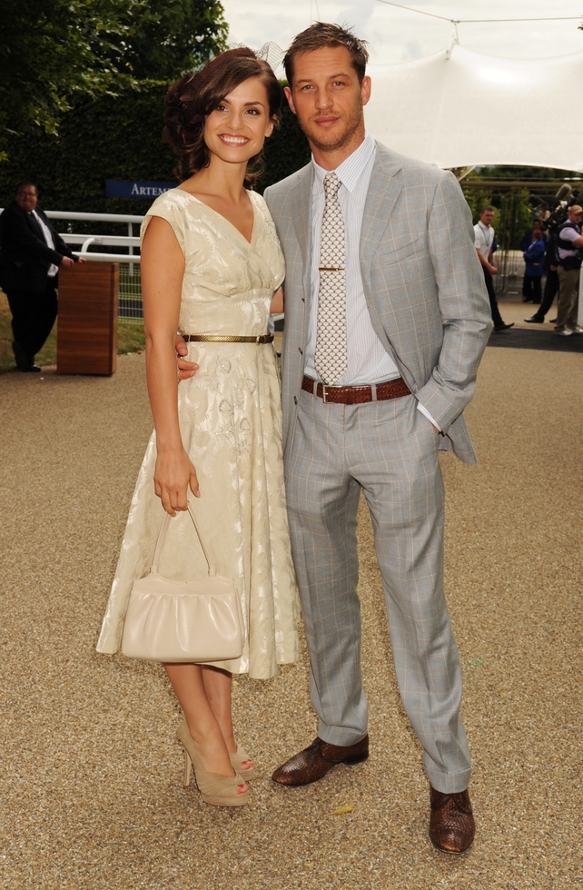 Tom Hardy and wife Charlotte Riley at the Goodwood Racecourse in 2010. The actor hits British style peak in this checked suit, brown shoes and belt!