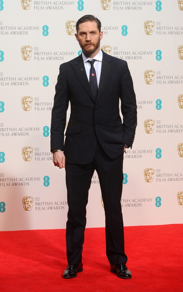 The actor looks very classy in a navy suit and shiny shoes at the British Academy Film Awards in 2014.
