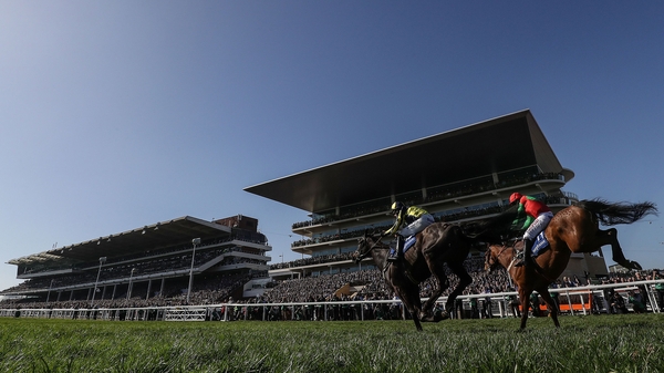 Willoughby Court ridden by David Bass (left) beats Neon Wolf ridden by Noel Fehily to win the first race of the day