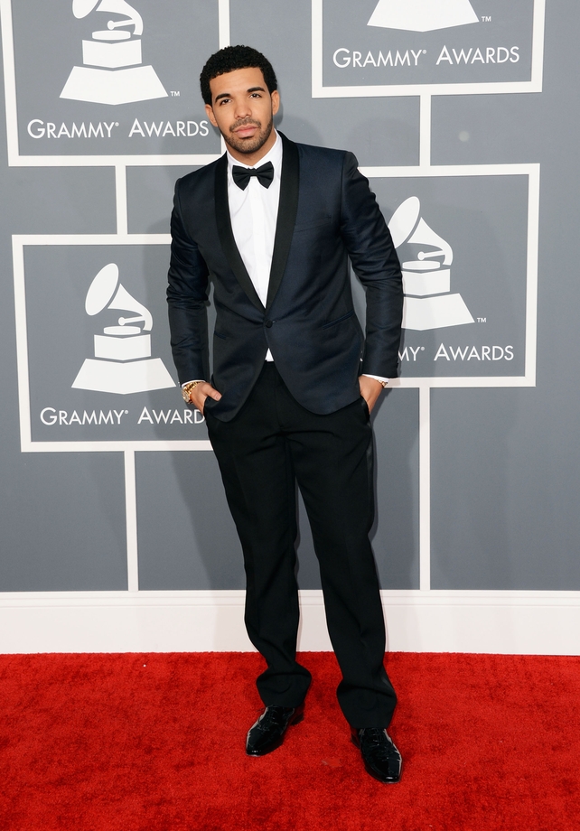 Rapper Drake super chic in this iridescent Saint Laurent suit at the Grammy Awards in 2013. You can call him on his cell phone...