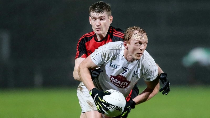 Kildare's Keith Cribbin and Down's Conor Maginn
battle for possession