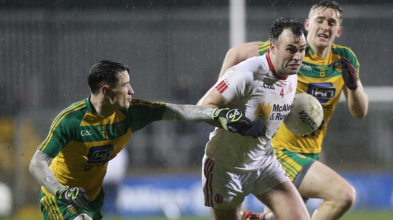 Tyrone's Cathal McCarron evades Martin O'Reilly and Hugh McFadden