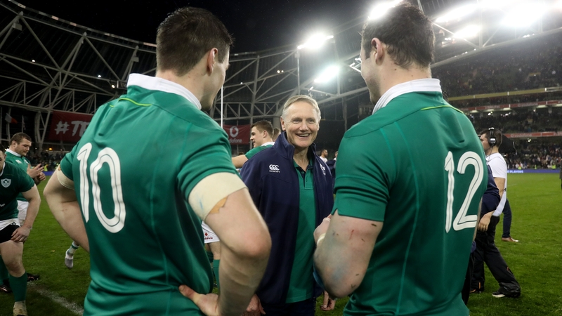 Joe Schmidt celebrates winning with Jonathan Sexton and Robbie Henshaw