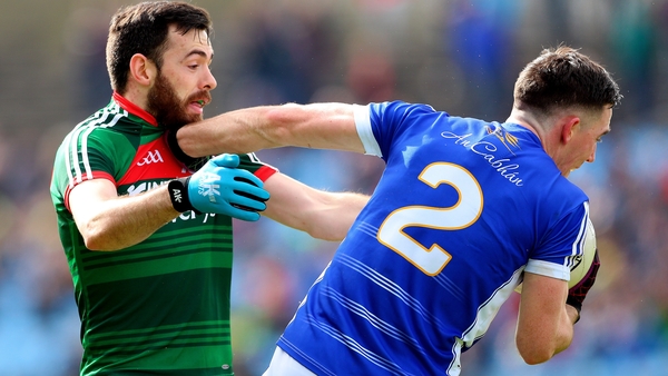 Mayo's Kevin McLoughlin and Cavan defender Killian Brady at MacHale Park