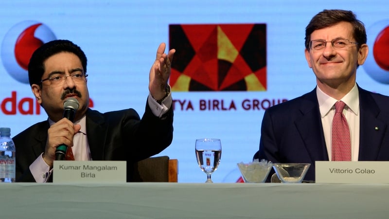 Chairman of India's Aditya Birla Group Kumar Mangalam Birla and Vodafone Group CEO Vittorio Colao at today's announcement