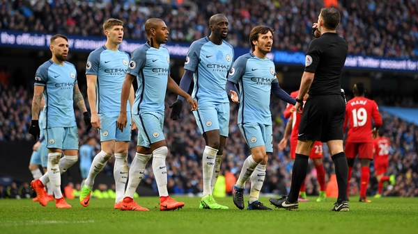 Manchester City players hone in on Michael Oliver