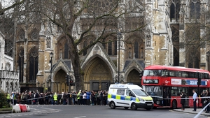 Around three shots rang outside parliament buildings after a man ran through the gates into the front yard