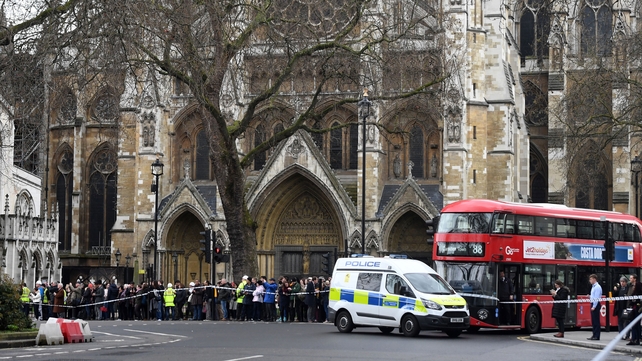 Around three shots rang outside parliament buildings after a man ran through the gates into the front yard