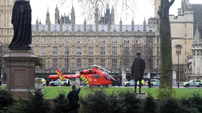 An air ambulance helicopter outside the Palace of Westminster on Parliament Square