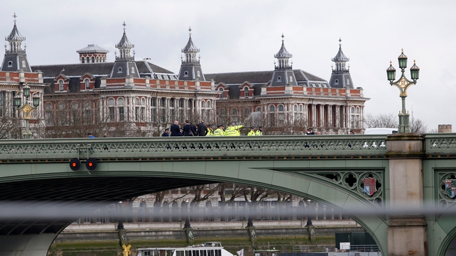 A crowd of passers-by was seen running from the direction of Westminster Bridge