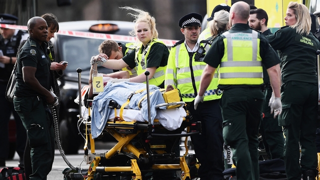 A member of the public is treated by emergency services near Westminster Bridge