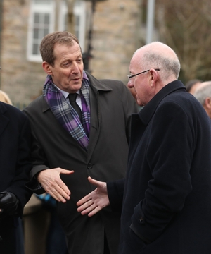 Former aide to Tony Blair Alastair Campbell greets Foreign Affairs Minister Charlie Flanagan