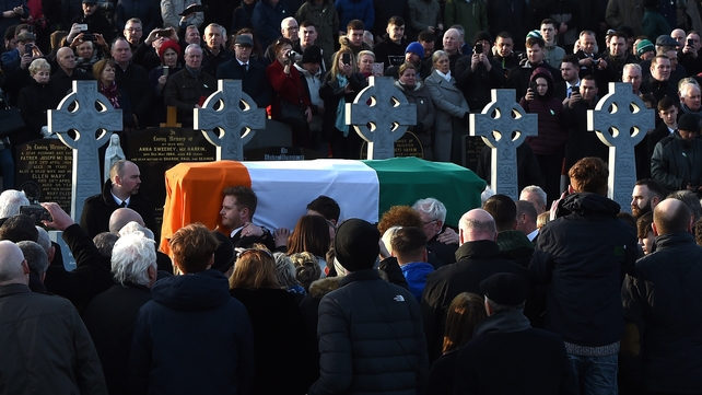 Martin McGuinness's coffin arrives at the City Cemetery