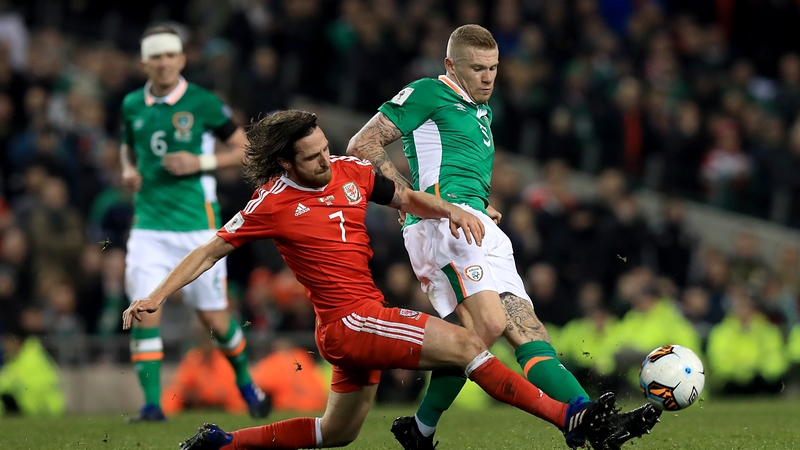 Joe Allen and James McClean battle for possession at the Aviva Stadium