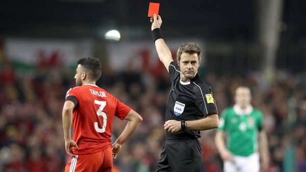 Neil Taylor is sent off by referee Nicola Rizzoli