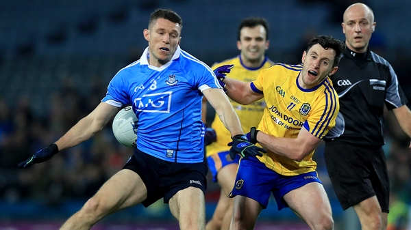 Dublin's Darren Daly with Ciaran Murtagh of Roscommon