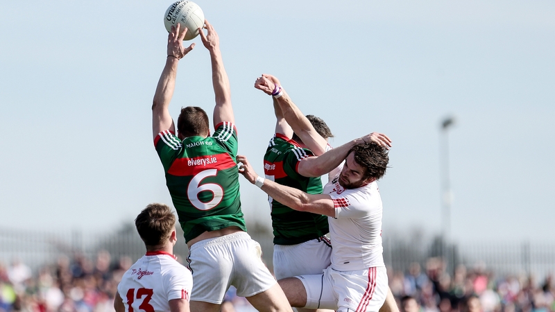 Ronan McNamee battles for possession against mayo's Lee Keegan