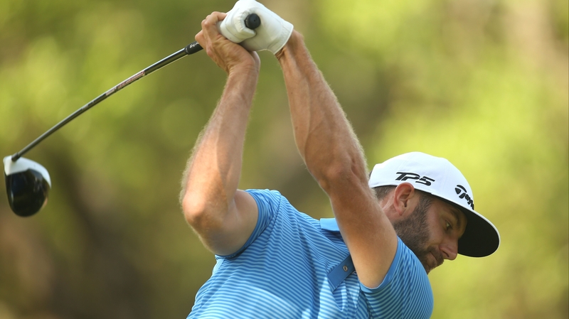 Dustin Johnson tees off on the 8th hole
