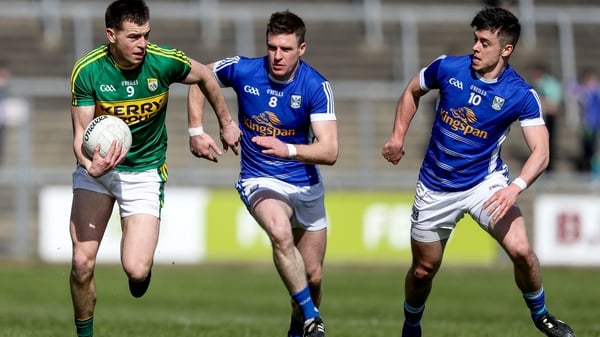 Cavan's Tomas Corr and Gerard Smith tackle Kerry's Jack Barry