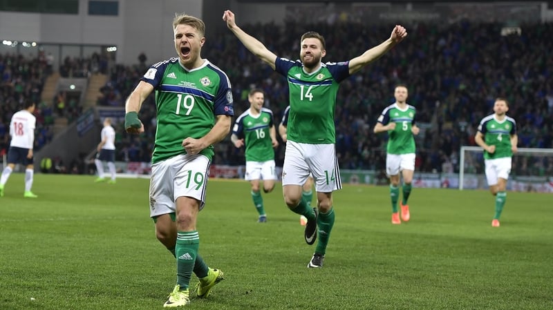 Jamie Ward (L) gave Northern Ireland the lead in the second minute